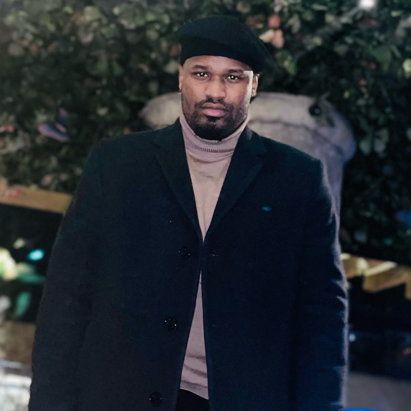 Dante Richardson in a dark coat and beret